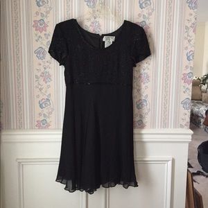 Black beaded knee length evening dress